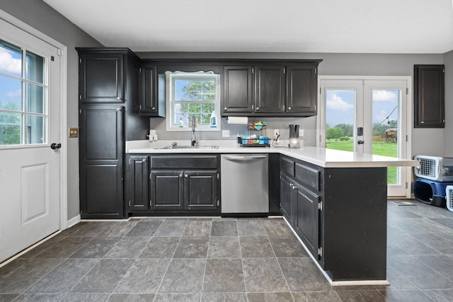 105 Gammons Ln, Lafayette, TN 37083 - kitchen with dishwasher, a peninsula, dark cabinets, french doors, and light countertops