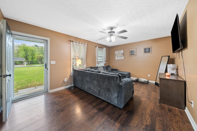 105 Gammons Ln, Lafayette, TN 37083 - living room with ceiling fan, dark wood-style flooring, and a textured ceiling
