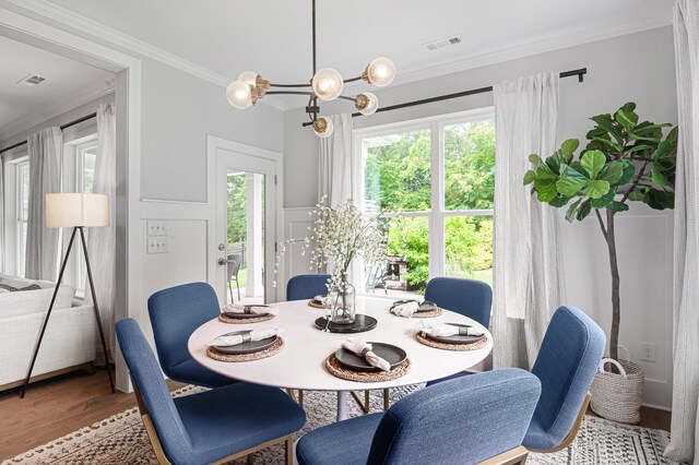2636 Bramblewood Ln, Thompsons Station, TN 37179 - dining room featuring crown molding, wood finished floors, and a chandelier