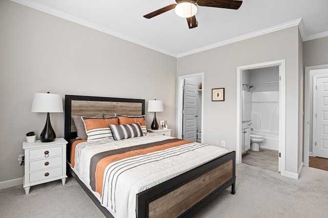 2636 Bramblewood Ln, Thompsons Station, TN 37179 - bedroom with light carpet, ornamental molding, ensuite bath, a walk in closet, and a ceiling fan