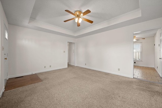 3230 S Senseney Cir, Clarksville, TN 37042 - unfurnished room featuring a tray ceiling, ceiling fan, carpet, crown molding, and a textured ceiling