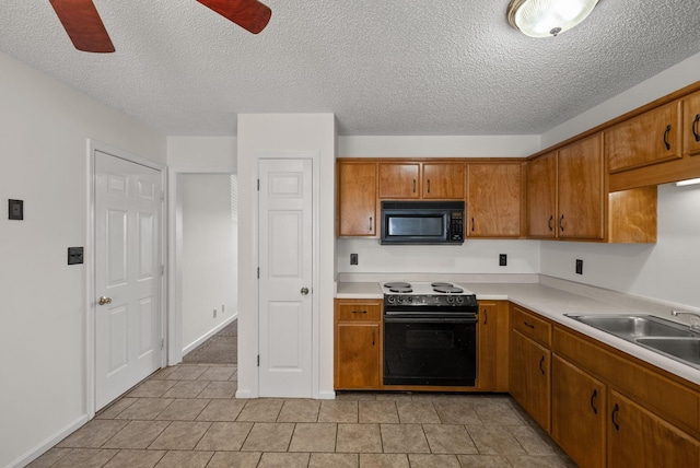 3230 S Senseney Cir, Clarksville, TN 37042 - kitchen featuring range with electric stovetop, black microwave, brown cabinetry, and a textured ceiling