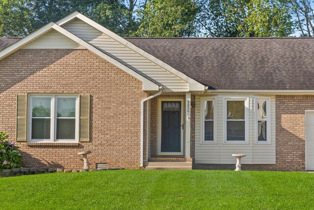 3230 S Senseney Cir, Clarksville, TN 37042 - view of front of property with a shingled roof, a front lawn, and brick siding