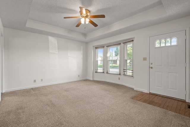 3230 S Senseney Cir, Clarksville, TN 37042 - entrance foyer featuring a tray ceiling, a ceiling fan, a textured ceiling, ornamental molding, and carpet flooring