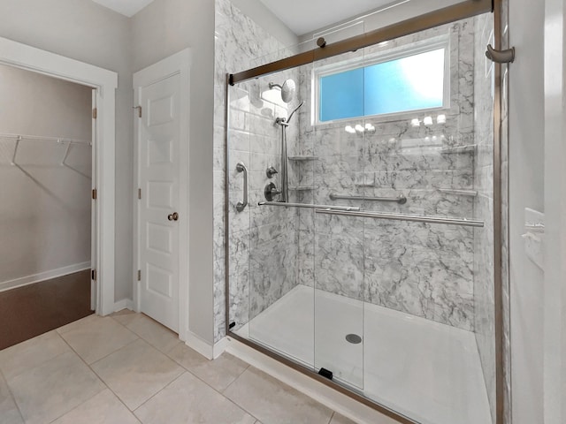 795 Ewell Farm Dr, Spring Hill, TN 37174 - full bathroom featuring a stall shower, a walk in closet, and tile patterned flooring