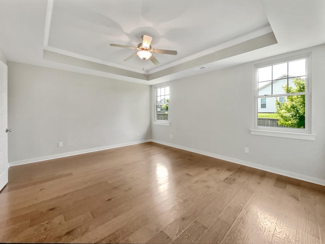 795 Ewell Farm Dr, Spring Hill, TN 37174 - empty room featuring a tray ceiling, wood finished floors, and ceiling fan