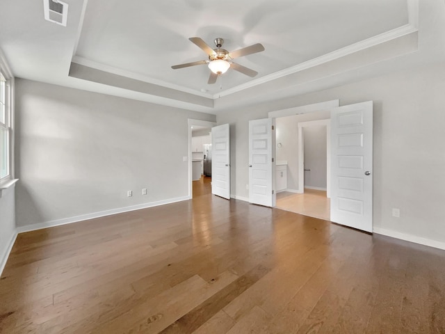 795 Ewell Farm Dr, Spring Hill, TN 37174 - unfurnished bedroom with a tray ceiling, crown molding, wood finished floors, and ceiling fan