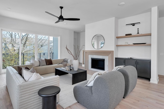 419 Acklen Park Dr, Nashville, TN 37205 - living area with a fireplace, a ceiling fan, and light wood-style flooring