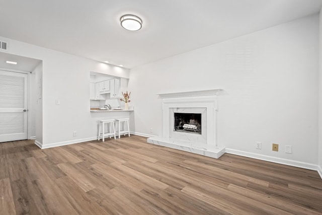 601 Boyd Mill Ave Unit O4, Franklin, TN 37064 - unfurnished living room featuring wood finished floors and a fireplace