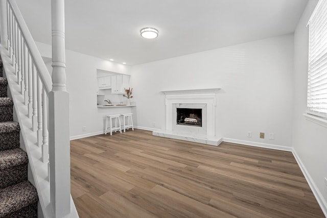 601 Boyd Mill Ave Unit O4, Franklin, TN 37064 - living area with stairs, wood finished floors, plenty of natural light, and a premium fireplace