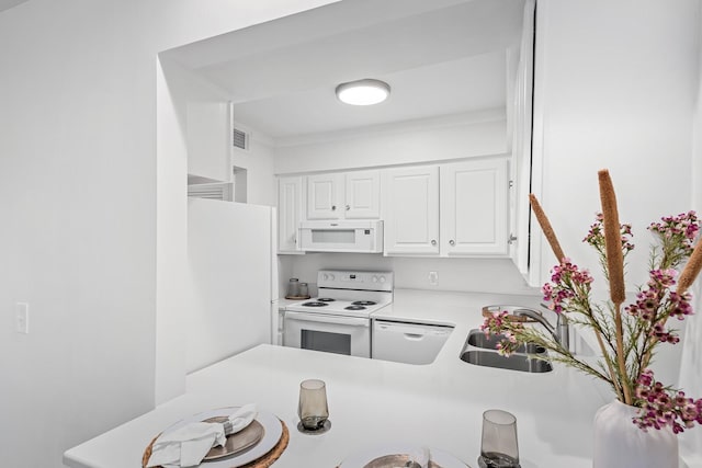 601 Boyd Mill Ave Unit O4, Franklin, TN 37064 - kitchen featuring white appliances, white cabinets, and light countertops