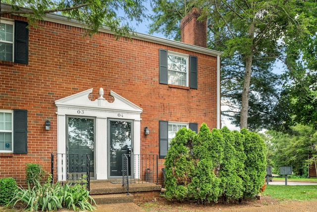 601 Boyd Mill Ave Unit O4, Franklin, TN 37064 - doorway to property with a chimney and brick siding