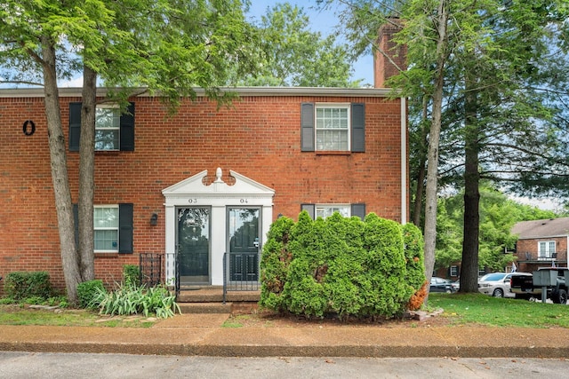 601 Boyd Mill Ave Unit O4, Franklin, TN 37064 - view of front facade with a chimney and brick siding