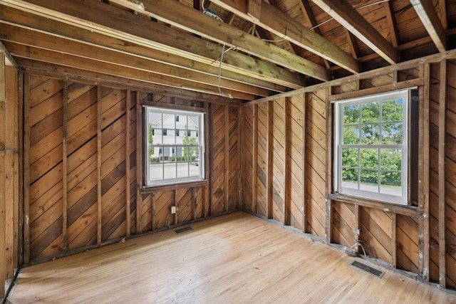 234 4th Ave N, Franklin, TN 37064 - misc room with healthy amount of natural light, wooden walls, and hardwood / wood-style flooring