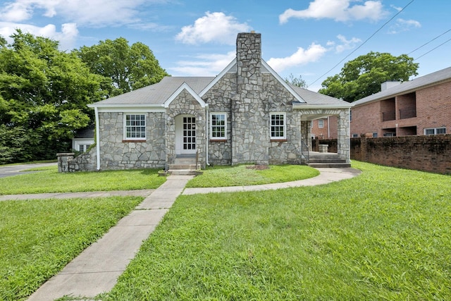 234 4th Ave N, Franklin, TN 37064 - view of front of home featuring stone siding, a chimney, and roof with shingles