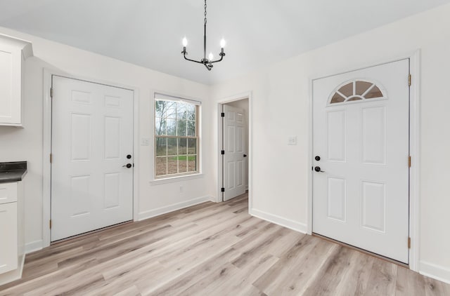 461 Summit Rd, Stanton, TN 38069 - entryway with a chandelier and light wood-style flooring