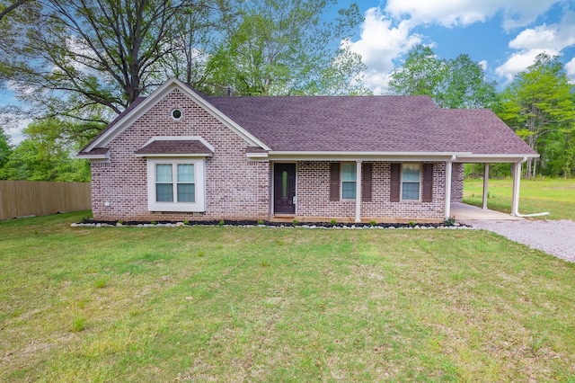 461 Summit Rd, Stanton, TN 38069 - view of front of property featuring roof with shingles, brick siding, a carport, and driveway