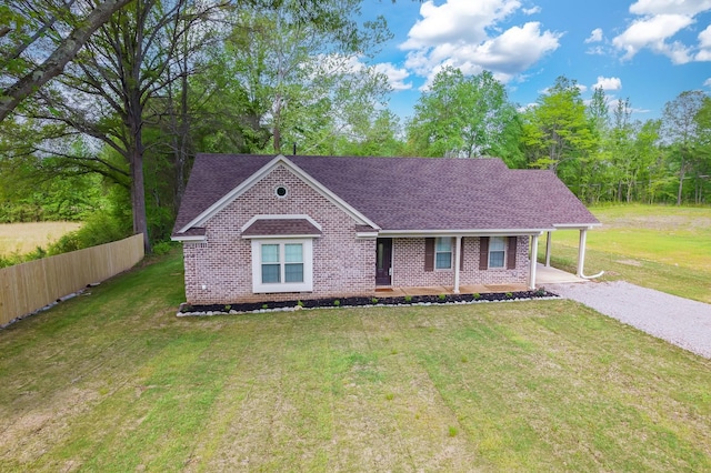 461 Summit Rd, Stanton, TN 38069 - view of front of home featuring brick siding, a shingled roof, driveway, and covered porch