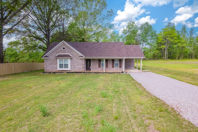 461 Summit Rd, Stanton, TN 38069 - view of front of house featuring driveway, brick siding, a carport, and a shingled roof