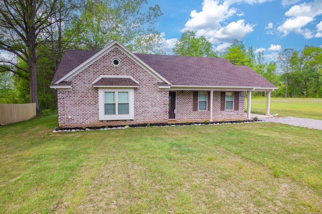 461 Summit Rd, Stanton, TN 38069 - view of front of house featuring roof with shingles, brick siding, a front lawn, and covered porch