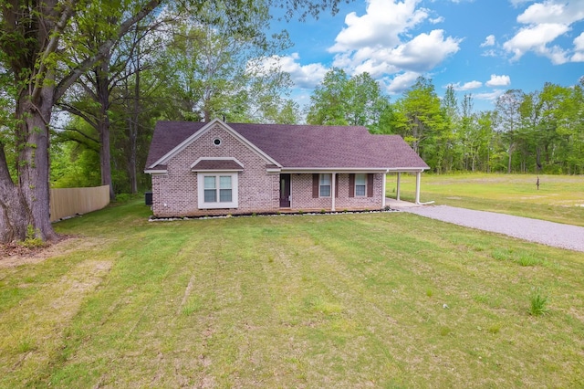 461 Summit Rd, Stanton, TN 38069 - view of front of house featuring brick siding, gravel driveway, and a front yard