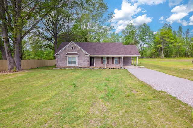 461 Summit Rd, Stanton, TN 38069 - view of front of home featuring gravel driveway, an attached carport, and brick siding