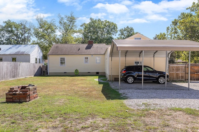 1529 Springvale Rd, Chattanooga, TN 37412 - back of property featuring crawl space, a carport, and a chimney