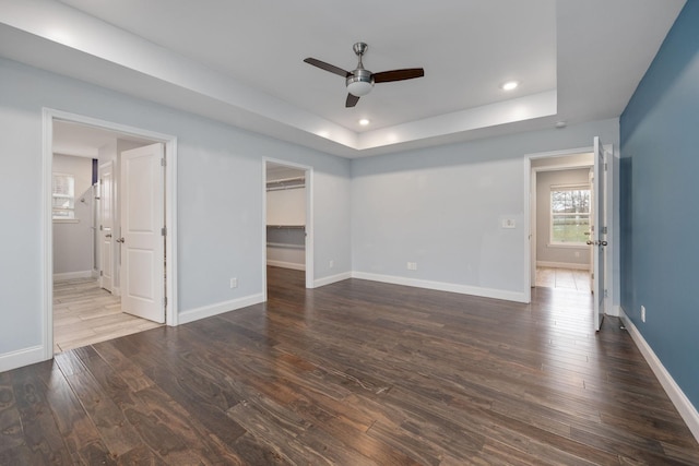 33 Maple Ln, Summertown, TN 38483 - unfurnished bedroom with a raised ceiling, dark wood-style flooring, a spacious closet, recessed lighting, and a ceiling fan