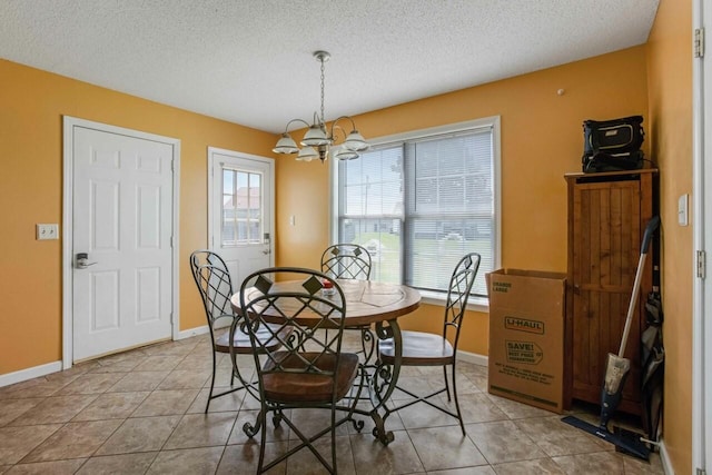 324 Chesire Way, Oak Grove, KY 42262 - tiled dining room with a chandelier and a textured ceiling