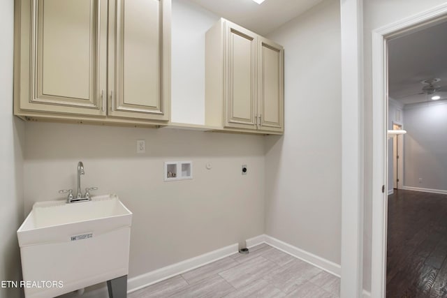 57 Riverview Dr, Oak Ridge, TN 37830 - laundry area with washer hookup, cabinet space, hookup for an electric dryer, gas dryer hookup, and light wood-style flooring