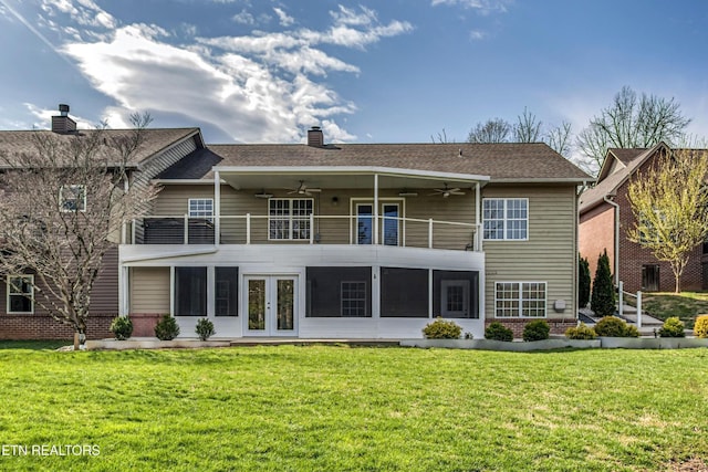 57 Riverview Dr, Oak Ridge, TN 37830 - rear view of house with french doors, a balcony, a ceiling fan, a chimney, and a lawn