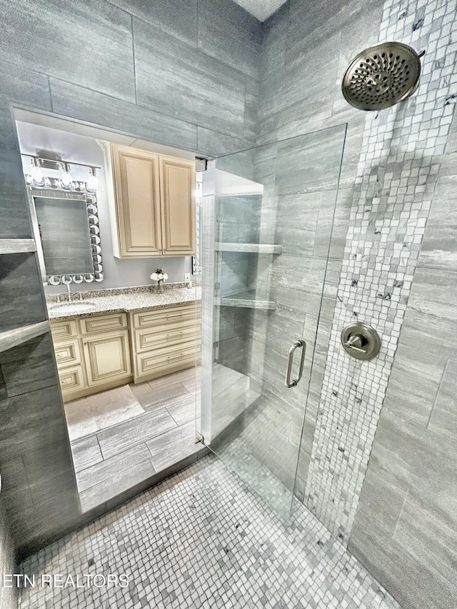 57 Riverview Dr, Oak Ridge, TN 37830 - full bathroom featuring a shower stall, double vanity, and tile patterned flooring