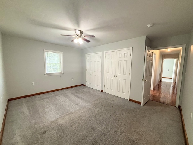 571 E Main St, Auburn, KY 42206 - unfurnished bedroom with two closets, carpet floors, and a ceiling fan