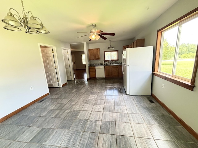 571 E Main St, Auburn, KY 42206 - kitchen with white appliances, a chandelier, ceiling fan, hanging light fixtures, and brown cabinets