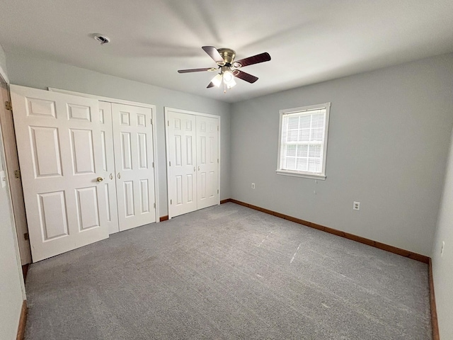 571 E Main St, Auburn, KY 42206 - unfurnished bedroom featuring two closets, carpet flooring, and ceiling fan