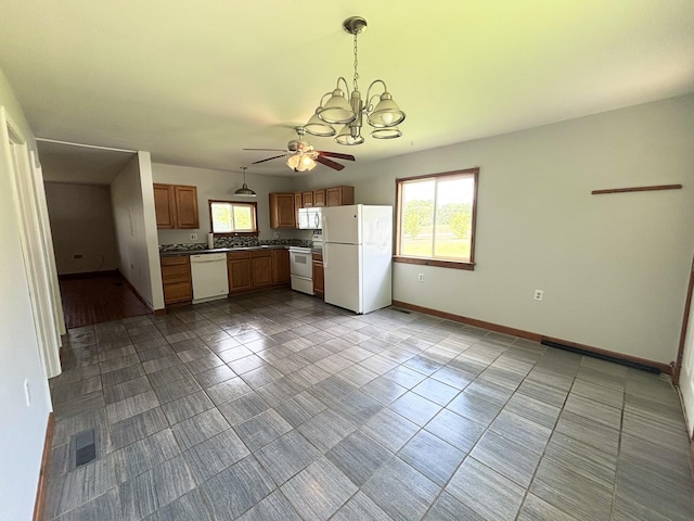 571 E Main St, Auburn, KY 42206 - kitchen featuring white appliances, ceiling fan, a chandelier, pendant lighting, and dark tile patterned flooring