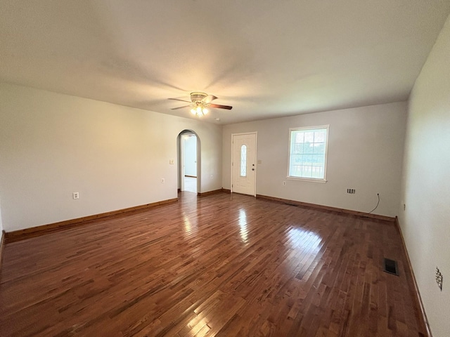 571 E Main St, Auburn, KY 42206 - unfurnished room with wood finished floors, arched walkways, and a ceiling fan