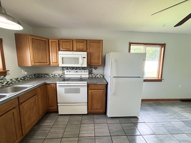 571 E Main St, Auburn, KY 42206 - kitchen with white appliances, brown cabinets, tasteful backsplash, and tile patterned floors