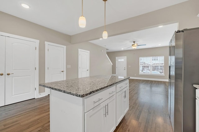 127 Dry Creek Commons Dr, Goodlettsville, TN 37072 - kitchen featuring freestanding refrigerator, dark wood-style floors, a ceiling fan, white cabinetry, and stone counters