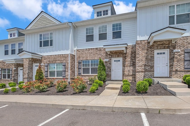 127 Dry Creek Commons Dr, Goodlettsville, TN 37072 - multi unit property featuring board and batten siding, brick siding, and uncovered parking