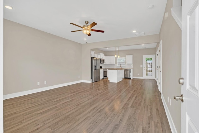 127 Dry Creek Commons Dr, Goodlettsville, TN 37072 - unfurnished living room with ceiling fan, light wood-style floors, and recessed lighting