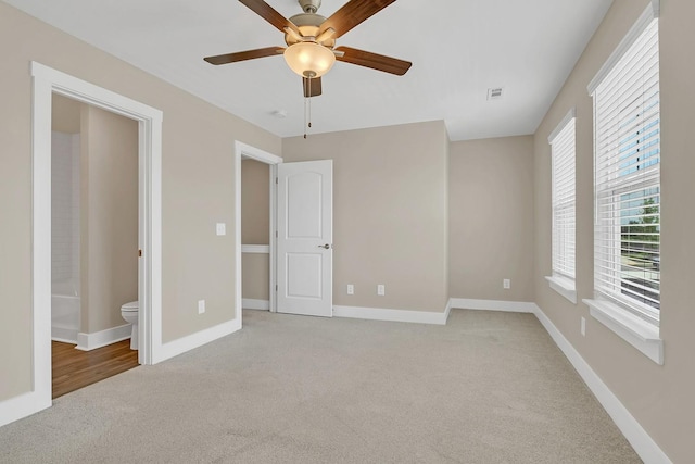 127 Dry Creek Commons Dr, Goodlettsville, TN 37072 - unfurnished bedroom with light carpet, ensuite bathroom, and a ceiling fan
