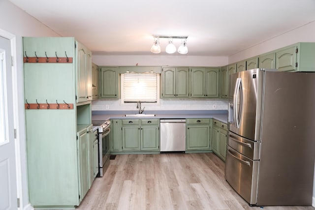 31 Community Rd, Lawrenceburg, TN 38464 - kitchen with stainless steel appliances, green cabinets, and light wood-style flooring