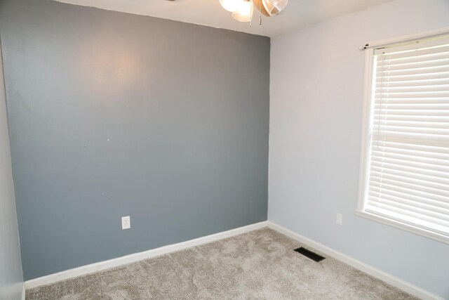 31 Community Rd, Lawrenceburg, TN 38464 - spare room featuring carpet floors, a ceiling fan, and plenty of natural light