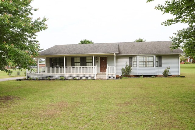 31 Community Rd, Lawrenceburg, TN 38464 - single story home with crawl space, a porch, a front lawn, and roof with shingles