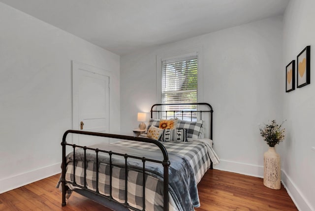 203 6th Ave, Columbia, TN 38401 - bedroom with wood finished floors and baseboards