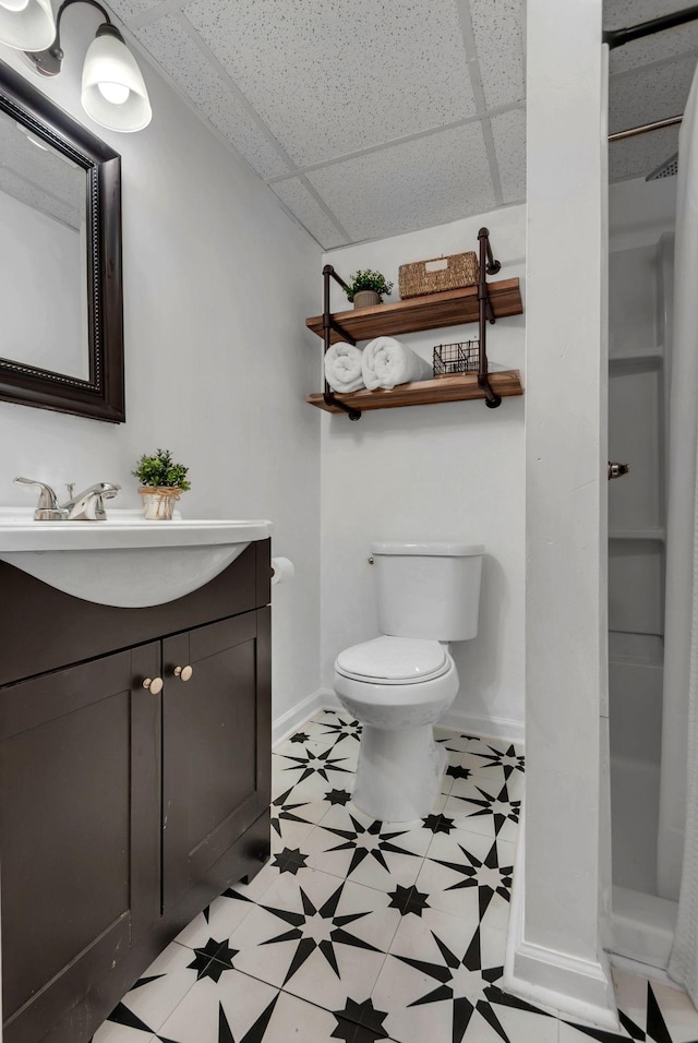 203 6th Ave, Columbia, TN 38401 - full bath featuring a drop ceiling, vanity, and tile patterned floors