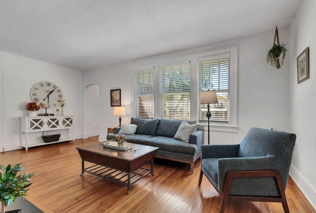 203 6th Ave, Columbia, TN 38401 - living area with light wood finished floors and arched walkways