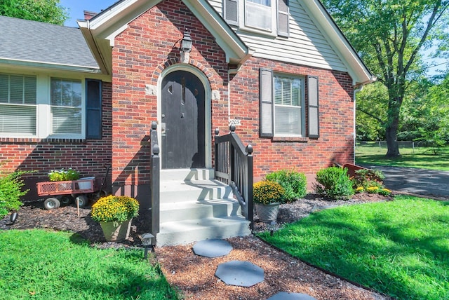 203 6th Ave, Columbia, TN 38401 - property entrance with brick siding and a lawn