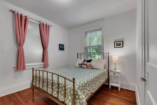 203 6th Ave, Columbia, TN 38401 - bedroom with wood finished floors and baseboards